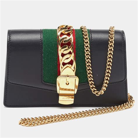 super mini sylvie chain wallet gucci|GUCCI Black Leather Super Mini Sylvie Wallet On Chain.